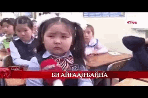 a little girl in a classroom with a tvb logo in the corner