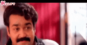 a man with a mustache is making a funny face in a movie .