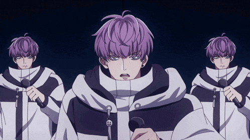 a man with purple hair holds a microphone in his hand