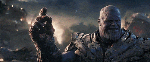 thanos from the movie avengers endgame is smiling and giving a high five