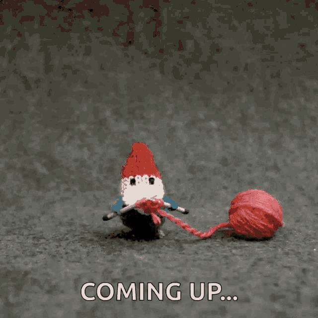 a picture of a gnome knitting with the words coming up behind him