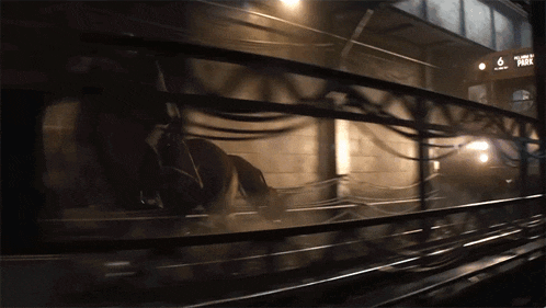 a train is going down the tracks with the number 6 on the side
