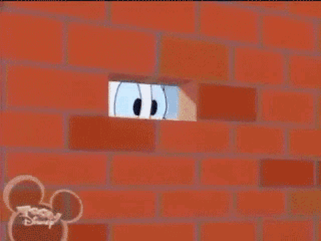 a cartoon character is flying through the air on a brick wall sponsored by toon disney