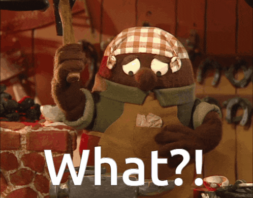 a cartoon character is holding a hammer and says " what ? "
