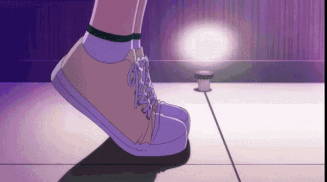 a person wearing a pair of white sneakers is standing on a purple surface