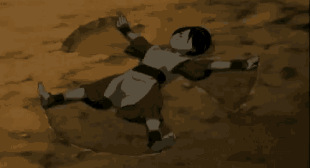 a cartoon character is laying in the dirt with his arms outstretched .