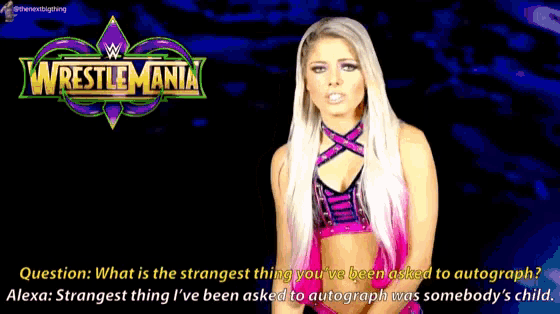 a woman is standing in front of a wrestlemania advertisement