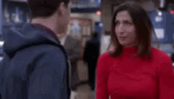 a man and woman are standing next to each other in a blurry photo .