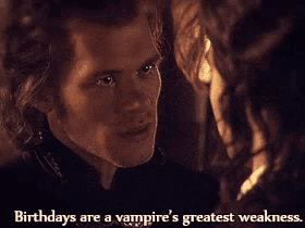 a man and a woman are looking at each other with the words birthdays are a vampire 's greatest weakness