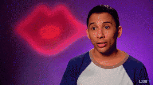 a man is making a funny face in front of a pink lip