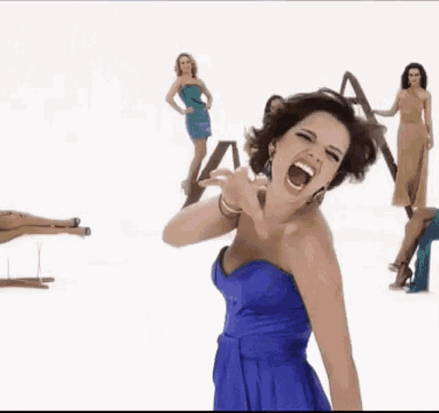 a woman in a blue dress is screaming with the words a vidente de diamantina in the background