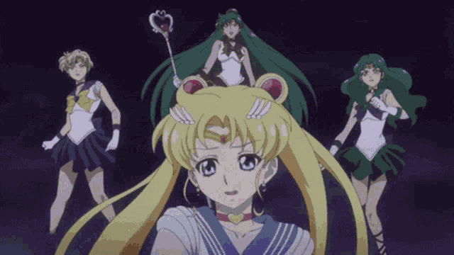 a group of sailor moon characters are standing together