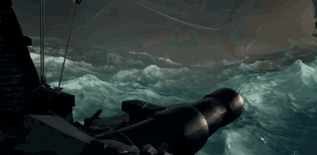 a cannon is pointing at a ship in the water