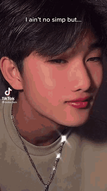 a close up of a young man 's face with the caption i ain 't no simp but .