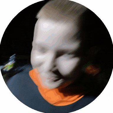 a blurry picture of a person 's face in a dark circle