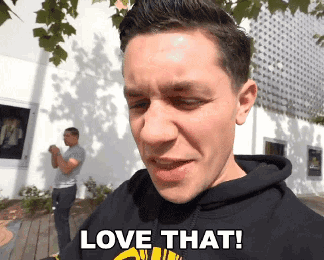 a man in a hoodie says love that