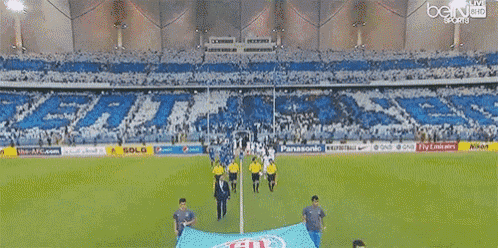 a soccer field with the word bein sports on the top