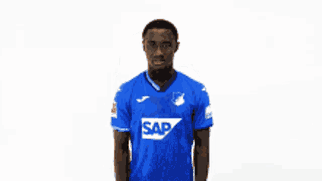 a man wearing a blue shirt with the word sap on the front