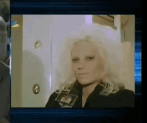 a close up of a woman 's face with a name tag that says ' rick ' on it