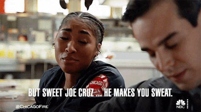 a woman in a chicago jacket talks to a man