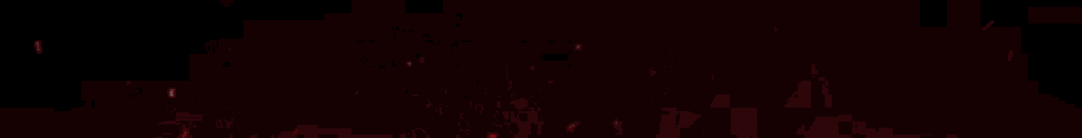 a close up of a red light beam on a dark background .