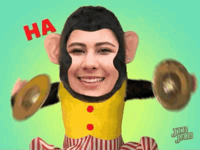 a woman in a monkey costume is holding cymbals