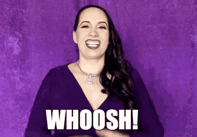 a woman in a purple dress is making a funny face and says whoosh !