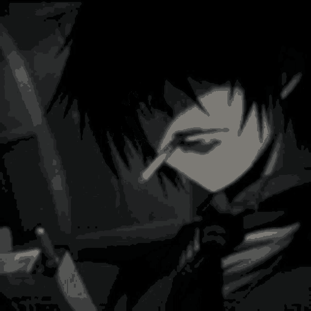 a black and white photo of a boy smoking a cigarette .