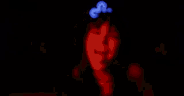 a woman covered in blood is holding a knife