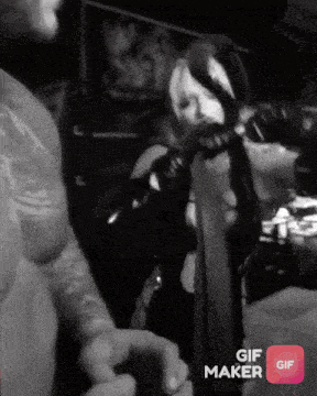 a black and white photo of a man and a woman with a gif maker icon in the corner