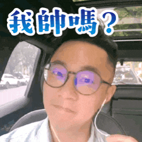 a man wearing glasses and headphones is sitting in a car with chinese writing on his face
