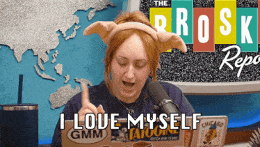 a woman wearing a headband that says ' i love myself gmm '