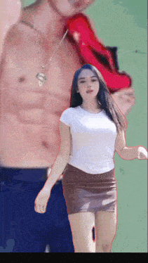 a woman in a white shirt and brown skirt is standing in front of a shirtless man with a superman necklace