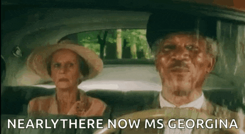 a man and a woman are sitting in a car .