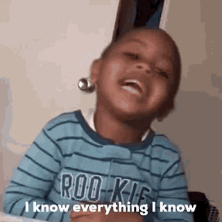 a little boy is laughing and saying `` i know everything i know '' while wearing a blue striped shirt .