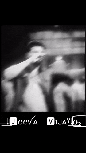 a black and white photo of a man with the words jeeva vijay 02 below him