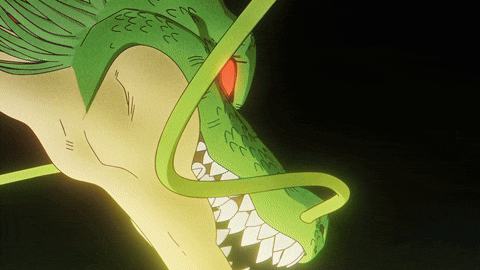 a close up of a dragon 's face with a red eye