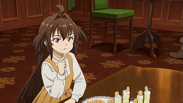 a girl with long brown hair is sitting at a table with lemonade and cookies