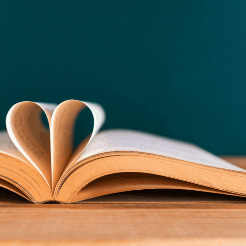 a book is open to a page that is folded in the shape of a heart