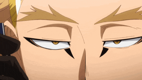 a close up of a man 's face with a yellow eye