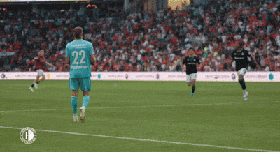 a soccer player with the number 22 on the back of his shirt