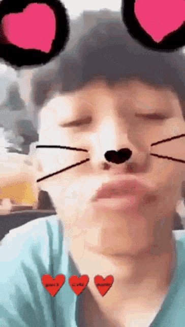 a man wearing a cat face filter with hearts on his eyes