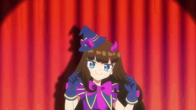 a girl in a witch costume with horns on her head