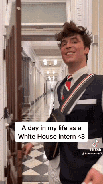 a man in a suit and tie is standing in a hallway with the caption a day in my life as a white house intern <