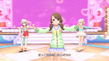 a girl in a green sweater is standing on a stage