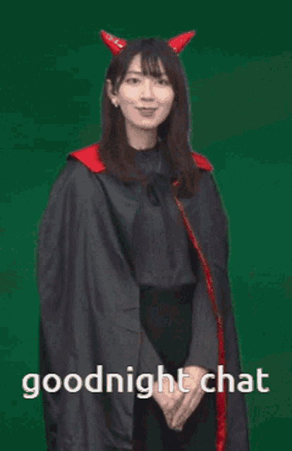 a woman wearing devil horns and a cape is saying goodnight chat