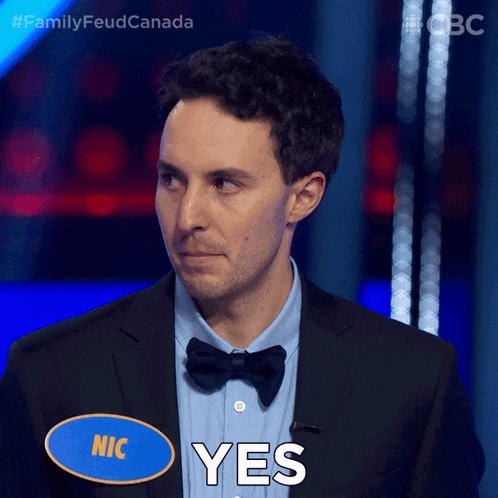 a man in a suit and bow tie says " yes "