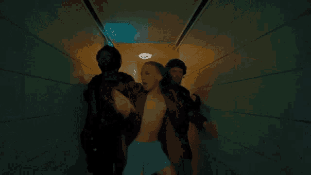 a man in a red robe is being pulled by a soldier