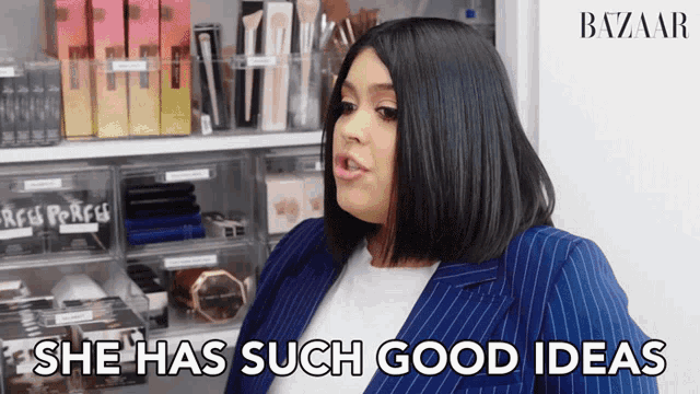 a woman says she has such good ideas in front of a shelf of makeup
