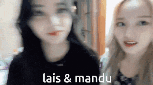two girls are standing next to each other with the words lais & mandu written on the bottom of the image .